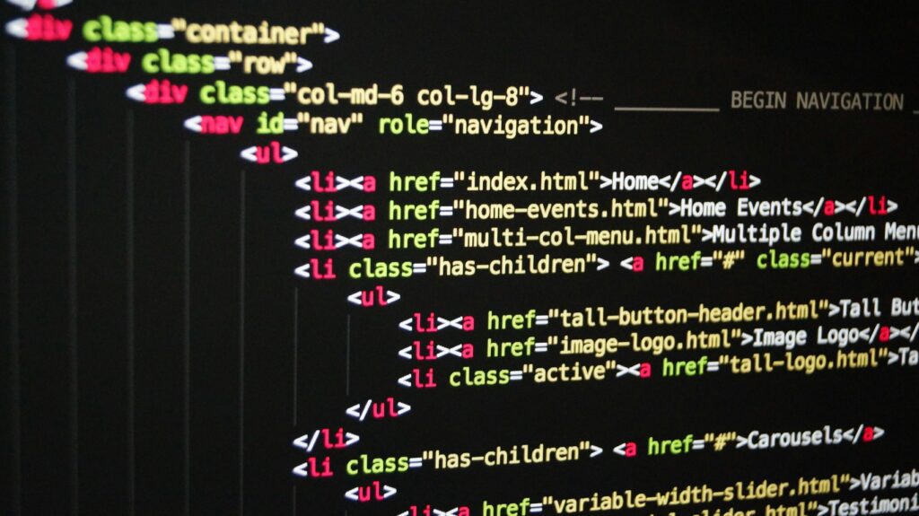 pexels-photo-270404-270404-1 Close-up of vibrant HTML code displayed on a computer screen, showcasing web development and programming.